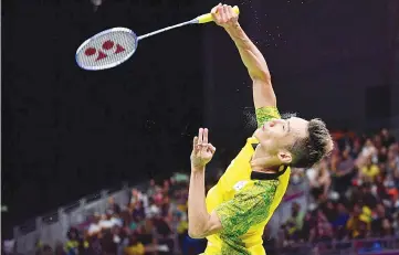  ??  ?? Malaysia’s Lee Chong Wei hits a return against India’s Srikanth Kidambi during the men’s badminton final at the 2018 Gold Coast Commonweal­th Games on the Gold Coast on April 15, 2018. - AFP photo