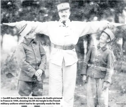  ?? Alison Harvey ?? > Cardiff-born World War II spy Jacques de Guélis pictured in France in 1944, showing his 6ft 3in height in the French military uniform which had to be specially made for him