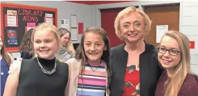  ??  ?? Center Hill Middle students Alayna Payne, Moriah Tims and Karly Marola are pictured with Mississipp­i Superinten­dent of Education Carey Wright, second from right. Center Hill Middle School was honored as a National Blue Ribbon School. RAINA HANNA / FOR THE COMMERCIAL APPEAL