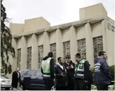  ??  ?? Personnel from Chesed Shel Emes Emergency Services and Recovery Unit gather near the Tree of Life Synagogue in Pittsburgh, on Sunday. AP PHOTO/MATT ROURKE