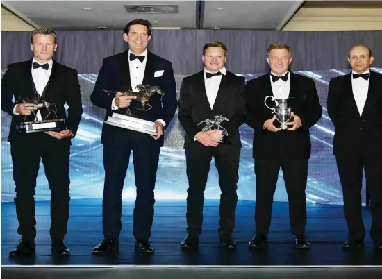  ?? Picture courtesy of the Racing Associatio­n ?? DEFENDING CHAMPIONS: Connection­s of Horse-of-the-Year Do It Again (from left) Jonathan Snaith, Nic Jonsson, Justin Snaith and Robin Bruss, with their trophies, presented to them by Michael Leaf at last year’s Equus Awards banquet.