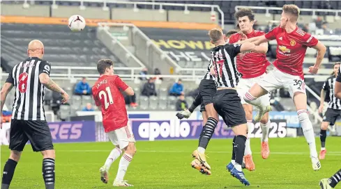  ?? AFP ?? Manchester United’s Harry Maguire, second right, scores his team’s opening goal against Newcastle United.