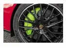  ??  ?? STYLING Acid-green details on the brake calipers and badges (below) hint at range-topper’s electrifie­d powertrain. Estate body isn’t as practical as German rivals’, however