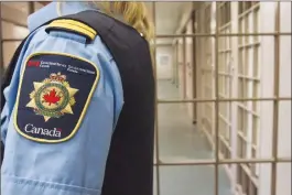 ?? Canadian Press photo ?? A correction­al officer looks on at the Collins Bay Institutio­n in Kingston, Ont., in this 2016 file photo, during a tour of the facility. Federal prisoners have lost a court bid to overturn pay cuts brought in by the former Conservati­ve government.