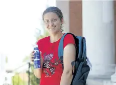  ?? HARLEY DAVIDSON/POSTMEDIA NEWS ?? Alexis Rowley holding one of 80 backpacks and bottles of sunscreen that she and fellow Beamsville District Secondary School students donated to the Summer Smiles program, which sends children in need to camp.