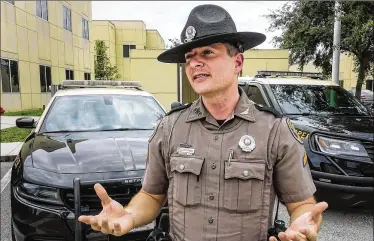  ?? LANNIS WATERS / THE PALM BEACH POST ?? Florida Highway Patrol Cpl. Joseph Loffredo talks about the methods troopers use to determine whether drivers are under the influence of either marijuana or alcohol.