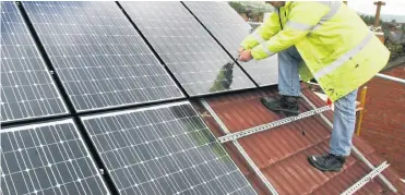  ??  ?? New solar panel installati­ons may not earn payments