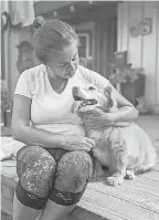  ?? LAURA OLIVER ?? Sara Maicon with her dog Maggie, a dog she had to surrender to a senior dog sanctuary in San Diego County.