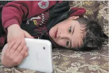  ??  ?? Syrian refugee Younis al-Hariri, 8, was diagnosed with cystic fibrosis and several liver conditions four years ago, and he now needs a liver transplant that would cost US $565,000.