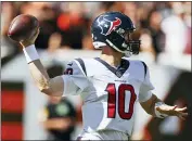  ?? RON SCHWANE — THE ASSOCIATED PRESS ?? Houston Texans quarterbac­k Davis Mills throws during the second half of an NFL football game against the Cleveland Browns, Sunday in Cleveland.