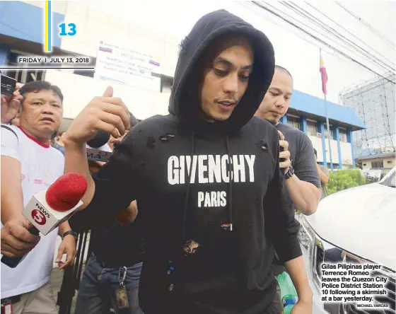  ?? MICHAEL VARCAS ?? Gilas Pilipinas player Terrence Romeo leaves the Quezon City Police District Station 10 following a skirmish at a bar yesterday.