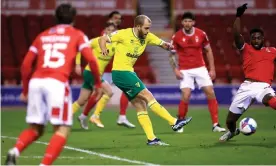  ??  ?? Norwich’s Teemu Pukki scores in the 2-0 victory over Nottingham Forest. Photograph: Mike Egerton/PA