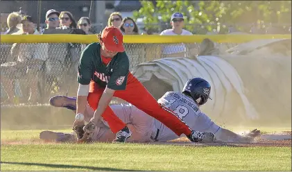  ?? STEVEN MAH/SOUTHWEST BOOSTER ?? 57’s third baseman Jerad Dokey got down low to block an errant throw against the Weyburn Beavers.