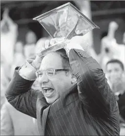  ?? Dylan Buell
Getty Images ?? AHMED ZAYAT, the owner of American Pharoah, celebrates with the Triple Crown trophy, which hadn’t been won since Affirmed in 1978.