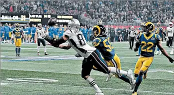  ?? TIMOTHY A. CLARY/GETTY-AFP ?? Patriots tight end Rob Gronkowski makes a lunging catch in the fourth quarter Sunday.