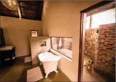  ??  ?? The en-suite bathroom in the luxury chalet leads to a private outdoor shower area.