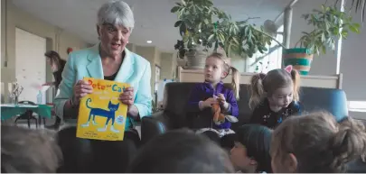  ?? CP PHOTO ?? B.C. Finance Minister Carole James reads Pete the Cat: I Love My White Shoes to students at the Downtown Y Child Care Centre in the YMCA in Victoria on Monday.