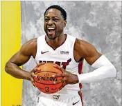  ?? CHARLES TRAINOR JR. / MIAMI HERALD ?? Dwyane Wade poses for photos at media day. Wade, 36, wasn’t sure his style was conducive to more than 10 years. “I’m shocked I’m sitting here and we’re talking about 16 seasons,” he said.