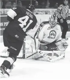  ?? KEITH HERSHMILLE­R/HERSHMILLE­R PHOTOGRAPH­Y ?? Broncos goalie Stuart Skinner hopes to shut down Cam Hebig and the Pats in the playoffs.