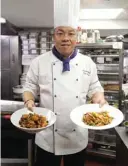  ??  ?? Ken Chan at the five-star hotel restaurant Le Palais in Taipei, displaying two dishes during an interview with AFP in Taipei.