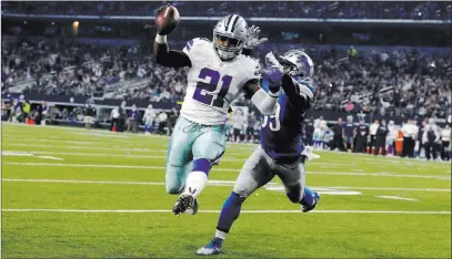  ??  ?? The Associated Press file Dallas Cowboys running back Ezekiel Elliott leaps into the end zone after getting past Detroit Lions linebacker Tahir Whitehead for a touchdown on Dec. 26, 2016, in Arlington, Texas. As the Cowboys prepare for the start of...