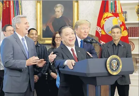  ?? Martin H. Simon Pool Photo ?? HOCK TAN, Broadcom’s chief, with President Trump in November. Last week, Trump blocked Broadcom’s $117-billion bid for Qualcomm.