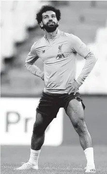  ?? AP PHOTOS ?? Liverpool’s Mohamed Salah stretches during a training session at the Besiktas Park Stadium, in Istanbul, Tuesday, August 13, 2019. The winners of Champions League, Liverpool and Europa League, Chelsea will play at the Super Cup soccer match on Wednesday.