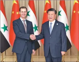  ?? YAO DAWEI / XINHUA ?? President Xi Jinping meets with Syrian President Bashar al-Assad in Hangzhou, Zhejiang province, on Sept 22. They announced the establishm­ent of a China-Syria strategic partnershi­p.