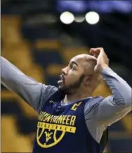  ?? CHARLES KRUPA — THE ASSOCIATED PRESS ?? Villanova’s Jalen Brunson, left, drives during a practice session Thursday at TD Garden in Boston. Brunson will take on former AAU teammate Jevon Carter when the teams square off in a Sweet 16 game Thursday night.