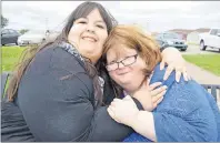  ?? SHARON MONTGOMERY-DUPE/CAPE BRETON POST ?? Janet Morrison, right, 39, of River Ryan, and her friend Jade Hall, 24, from Clare Suffolk, England, share an affectiona­te moment together while visiting the Cape Breton Miners’ Museum in Glace Bay on Tuesday. Janet and Jade, who both suffer from...