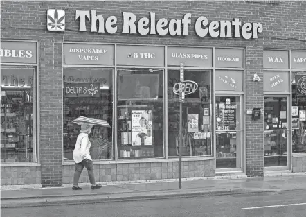  ?? ADAM CAIRNS/COLUMBUS DISPATCH ?? THC products and parapherna­lia, including delta 8, are advertised as being sold at Releaf Center in the University District.