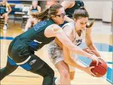  ?? Photo courtesy of Brooke Baldwin/JBU Sports Informatio­n ?? John Brown sophomore Tarrah Stephens, right, battles with Southweste­rn Christian’s Gillian Snowder for the ball during Wednesday’s game at Bill George Arena. Southweste­rn Christian defeated the Golden Eagles 66-63.