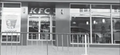  ??  ?? The KFC outlet housed under the Nalico/Nafico headquarte­rs on Hincks Street