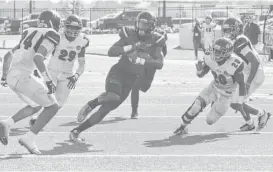  ?? Tony Gaines / Houston Chronicle ?? Westfield’s Noah Massey, center, hauls in a 20-yard reception near the goal line while trying to evade a host of Lufkin defenders during Saturday’s game.