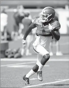  ?? NWA Democrat-Gazette File Photo/ANDY SHUPE ?? Arkansas’ Kamren Curl runs Aug. 13 during practice at the university practice facility in Fayettevil­le.