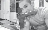  ?? SEMINOLE-BREVARD STATE ATTORNEY’S OFFICE ?? Jericho Fine holds an IWI Jericho 941 handgun. Blake Turpin said in court Thursday he believed Grant Amato stole the weapon shortly before Amato’s family was killed.