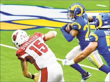  ?? Wally Skalij Los Angeles Times ?? RAMS CORNERBACK Troy Hill, returning an intercepti­on 84 yards for a touchdown in Sunday’s 18- 7 win over Arizona, is among the players who have excelled under f irst- year defensive coordinato­r Brandon Staley.