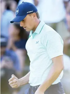  ??  ?? Jordan Spieth pumps his fist after sinking a birdie putt on the18th hole during the third round of the Travelers Championsh­ip golf tournament at TPC River Highlands on Saturday in Cromwell, Conn.
