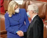  ?? ANDREW HARNIK/POOL VIA ASSOCIATED PRESS ?? Rep. Liz Cheney, R-wyo., greets Senate Minority Leader Mitch Mcconnell, R-KY., before President Joe Biden’s speech to a joint session of Congress on Wednesday.