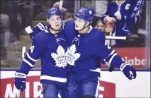  ?? Canadian Press photo ?? Toronto Maple Leafs centre William Nylander (right) celebrates his goal against the Buffalo Sabres with teammate Auston Matthews during second period NHL hockey action in Toronto on April 2.