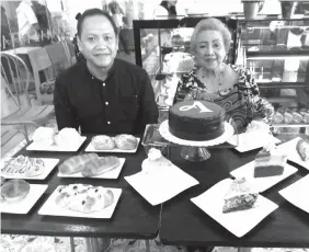  ?? ALDO NELBERT BANAYNAL ?? Anita's Bakeshop general manager Benjamin Cabinian (left) and founder Anita Cabinian (right) said that the brand, which marks 49 years since its inception, has to compete head on with the rising competitio­n in the bakeshop industry of Cebu.