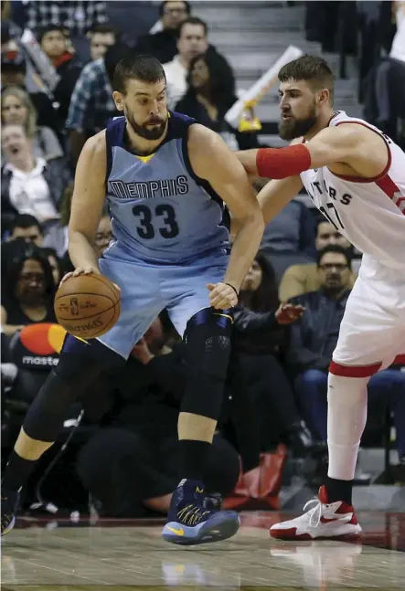  ?? Jack Boland ?? Many Raptors fans are worried the acquisitio­n of former Memphis Grizzlies centre Marc Gasol, left, in a swap for Toronto fan favourite Jonas Valanciuna­s, is a trade that doesn’t make sense over the long run.