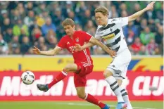  ?? — Reuters ?? Borussia Moenchengl­adbach’s Jannik Vestergaar­d and Bayern Munich’s Thomas Mueller in action.