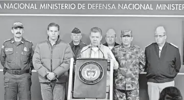  ??  ?? Colombia’s President Juan Manuel Santos (centre) speaks during a news conference in Bogota. — Reuters photo