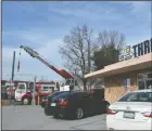  ?? CHRISTINA CORNEJO/ NEWS-SENTINEL ?? A crane is set up on Pleasant Avenue near Lodi Avenue in order to replace Lodi House Thrift Store’s old HVAC unit on Monday.