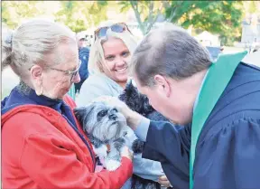  ?? FCC Madison / Contribute­d photo ?? BLESS THE ANIMALS: The Rev. Todd Vetter and the Rev. Sara Vetter of the First Congregati­onal Church of Madison will bless all of God’s creatures — living or stuffed — which walk, run, swim, fly or crawl, say event organizers. You do not have to be a member of FCCM to participat­e on the church lawn for the event.