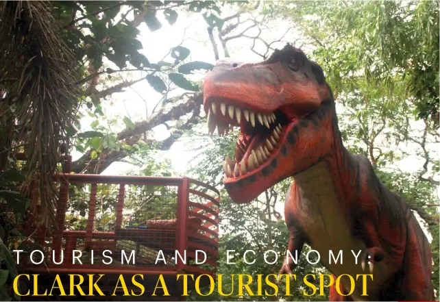  ??  ?? FEED IT with a punching bag-sized drumstick, and this t-rex will roar. SUNSTAR FOTO / JOHANNA MICHELLE LIM