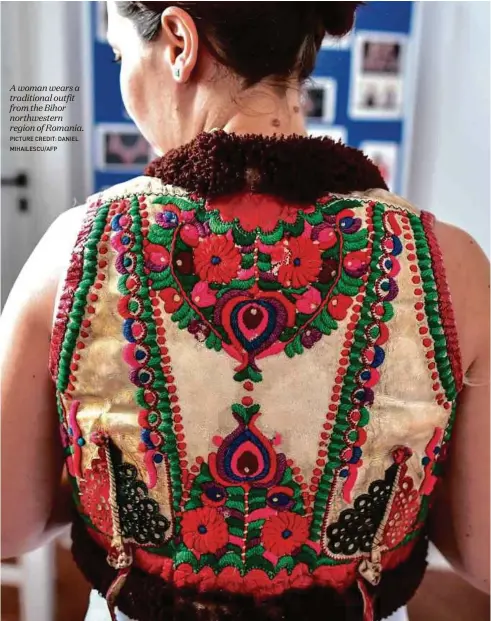  ?? Picture credit: daniel Mihailescu/aFP ?? A woman wears a traditiona­l outfit from the Bihor northweste­rn region of Romania.