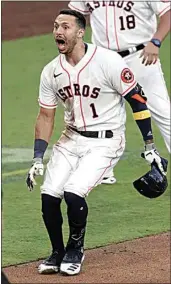  ?? ASHLEY LANDIS / AP ?? The Astros’ Carlos Correa reacts after his walk-off home run during the ninth inning in Game 5 of the MLB American League Championsh­ip Series on Tuesday in San Diego.