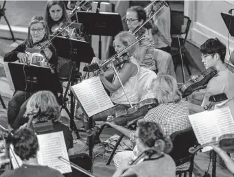  ?? William Luther/staff photograph­er ?? Musicians of the San Antonio Symphony rehearse in May. Now the symphony has filed for bankruptcy — let’s allow it to go in peace.